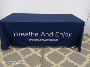 Logo tablecloth on blue fabric with white lettering