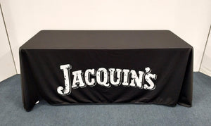 custom-printed logo tablecloth on black polyester with white letters