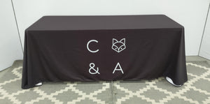 Black 6 foot polyester table throw with white center print logo