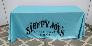 Restaurant logo tablecloth, blue fabric, black lettering