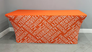 Orange stretch-spandex corporate tablecloth with logo, front view