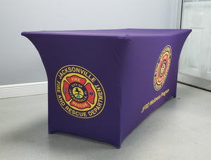 Blue Spandex table cover printed with Jacksonville Fire rescue logo