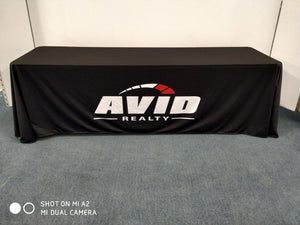 A showroom tablecloth printed with a corporate logo in white and red