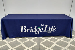 Fitted Blue tablecloth with white and green company logo
