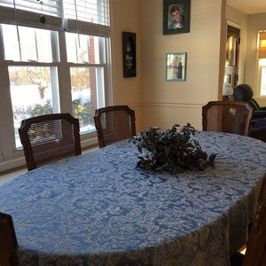 blue damask tablecloth on a large oval table