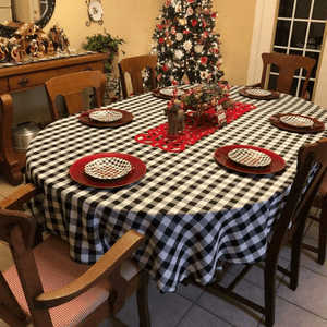 Gingham check oval tablecloth during Christmas season in a home dining room