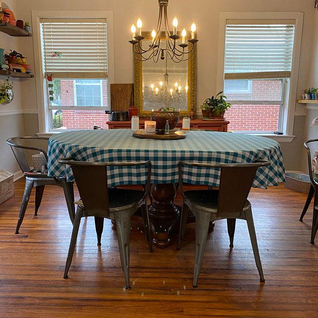 Checkered oval tablecloth in a country home dining room 