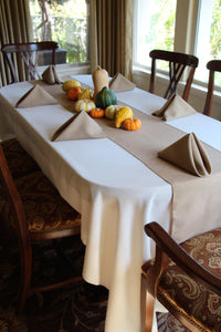 Natural colored Havana napkins with a matching table runner  with baby squash at the center