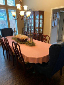 Orange fall tablecloth on a oval table