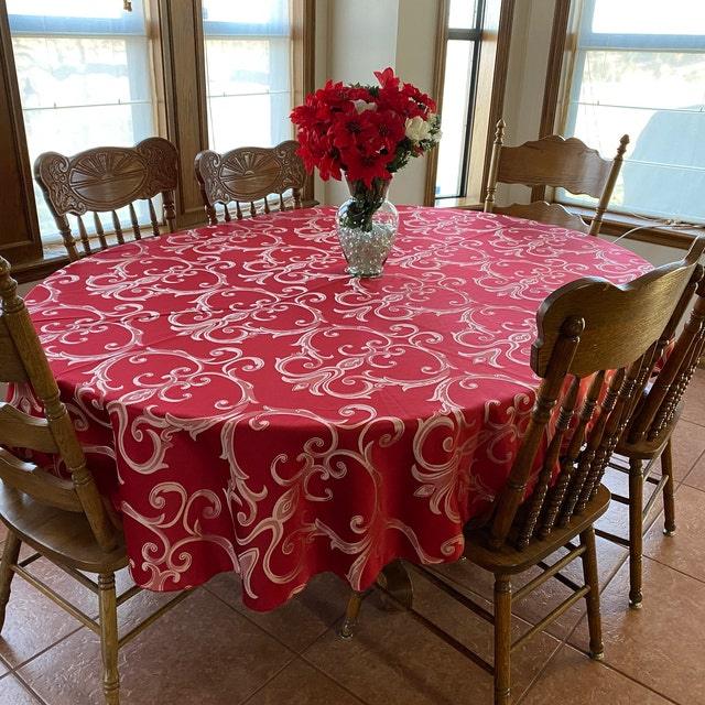 Red damask tablecloth in a dinning room.