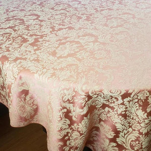 Closeup of a oval tablecloth with damask pattern
