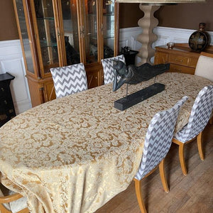 Large oval tablecloth with a buddha statue on the table 