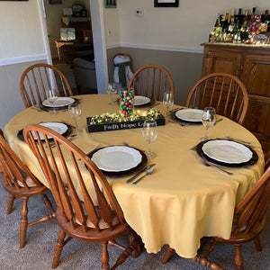 Gold oval tablecloth set during the holidays