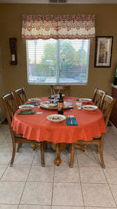 Orange oval tablecloth in a country home