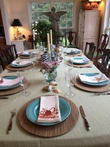 Panama linens on a family dining table with a bowl at the center and place settings