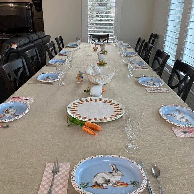 Elegant table linens at a family Easter celebration with Bunnies and carrot decorations