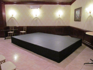 Black Stage skirt on an inside stage with seating around 