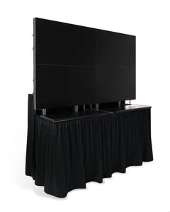 Side view of a custom Poly skirt attached to a stage in black with screens on top 