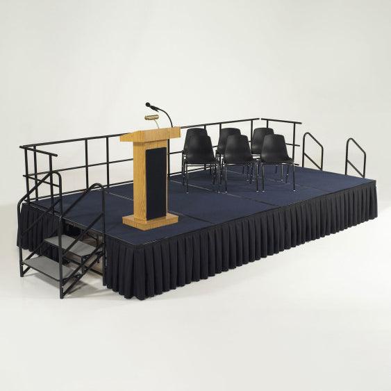 Black Stage skirt with box pleats on stage with Podium and chairs on top