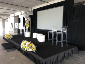  Black box pleat skirt on a small party stage set up with balloons and flowers