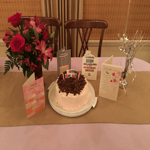 Havana table cloth and table runner in a family Birthday celebration with cake, flowers, and cards