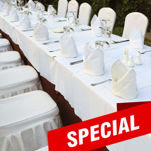 White poly table linens on tables set up side by side with matching standing napkins