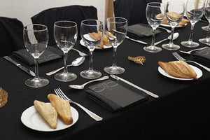  Black premier table linens with matching napkins and chair covers at business dinner