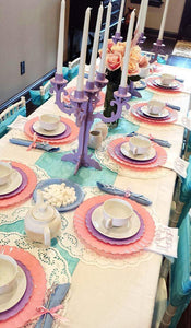 Dinner linens on a long family table with table runner and Easter decorations