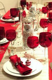 Holiday Red tablecloth on a reception table with glasses and a white table runner