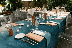 Fine wedding linens in various colors across many tables with napkins 