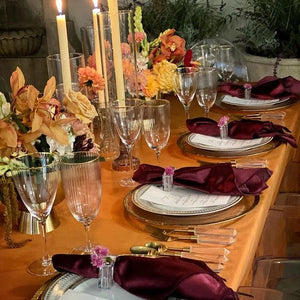Fine velvet table linens in our Spice color with place settings, plates, and napkins