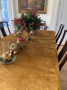 Fine Table linens with Christmas decor throughout the room