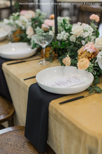 Velvet tablecloth with napkins under bowl and champagne glasses