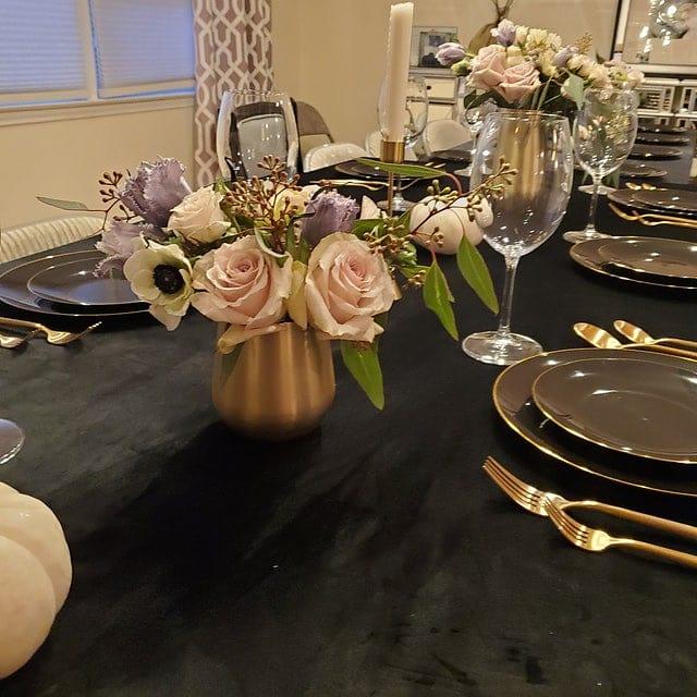 Hunter Green Velvet tablecloths on 2 tables in a home dining scene with roses and candles