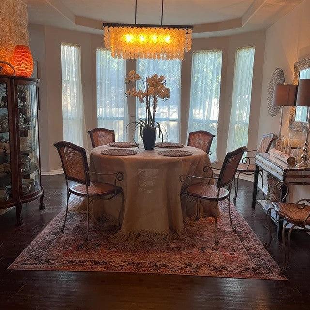 Round Burlap Tablecloth with fringe in an elegant dining room