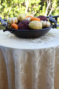 Round damask tablecloth on a patio