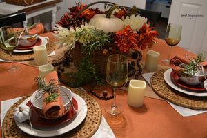 a Spice colored table linens in a home dining set up with matching napkins and pumpkin centerpiece