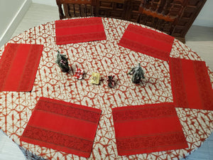 Round shibori tablecloth and placemats in a dining room