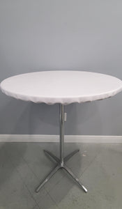 White round vinyl table topper on a cocktail table