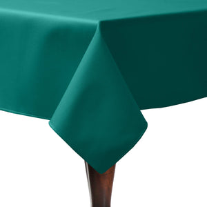 Green table linens on a formal home table