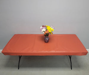 Vinyl Fitted Tablecloth ith flannel back on a table with flowers
