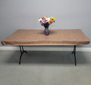 Vinyl Fitted Tablecloth with flannel back shown on a rectangular table